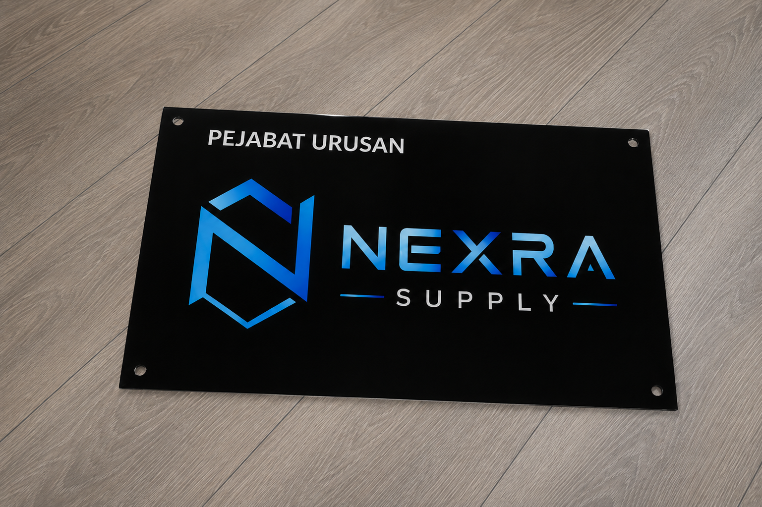 Black acrylic office signage with NEXRA Supply logo